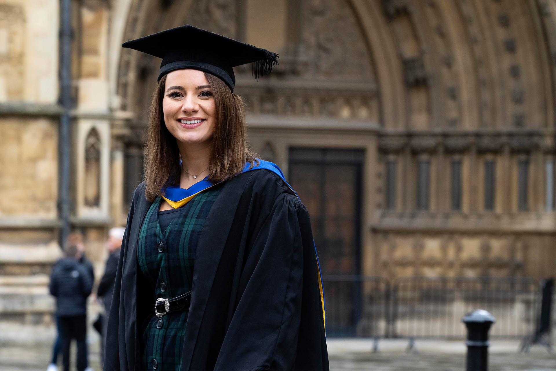 Student at graduation outside Bristol Cathedral